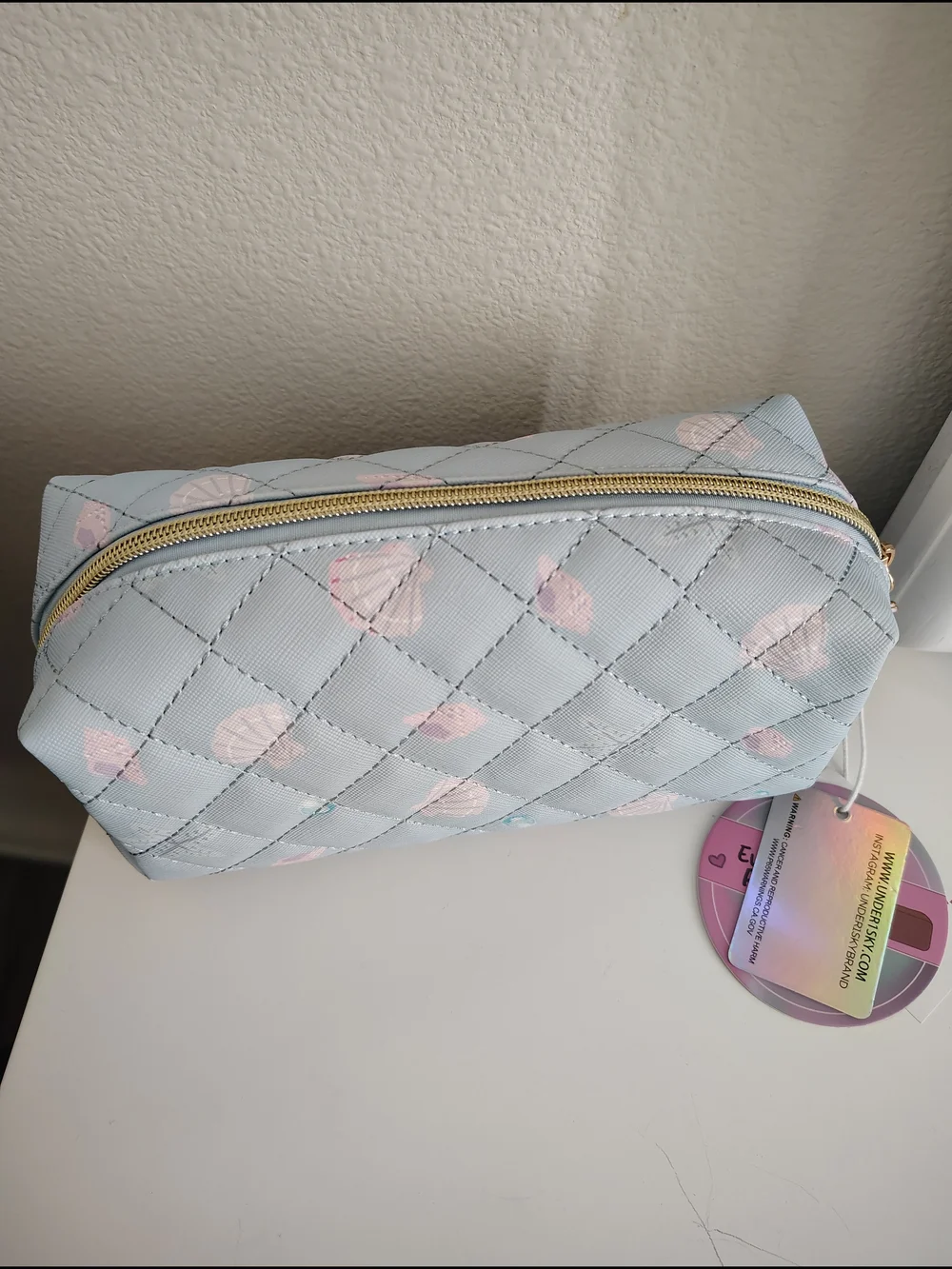 Under One Sky Quilted Cosmetic Pouch in Pale Blue with Light Pink Shells